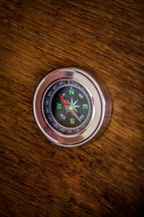 compass on a wooden background