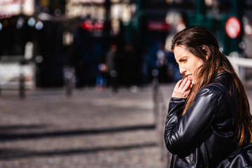 Fototapeta premium Portrait of young brown-haired woman with worried gesture.