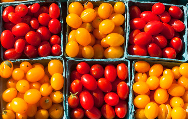 Close-up on cherry tomatoes at a outdoors farmers market