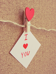 Red hearts hung with clothespins. Happy lovers day card mockup. Valentine's Day concept with heart. Top view. Copy space.background for love content or valentine day or about married.Festive concept.