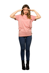A full-length shot of a Teenager girl with pink sweater has just realized something and has intending the solution on isolated white background