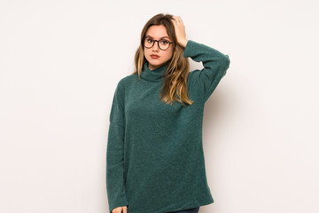 Fototapeta premium Teenager girl over white wall with an expression of frustration and not understanding
