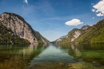 Fototapeta na wymiar Beautiful panorama on Kenigssee lake.Colorful morning view of the Bavarian Alps on the border of Austria, Germany, Europe.Photo of beautiful landscape.Green water with montains.