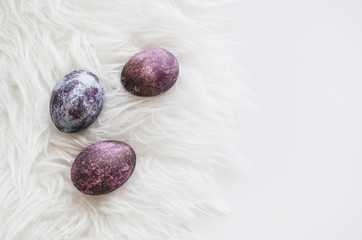 Delicate composition for the holiday of Easter. Painted eggs. Background for the presentation of work or text.  Top view. Copy space.  Mock-up