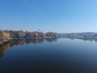 Nesvizh Castle from across the pond in autumn. Minsk Region, Belarus. Site of residential castle of the Radziwill family. 
