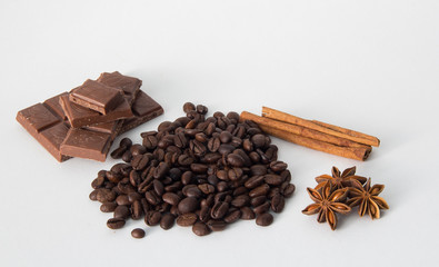 coffee,chocolate,beans,background,spices,anise,cinnamon,sweet,food,brown,nut,dessert,gourmet,almonds,spice,sugar,wooden,tasty,broken,white,cocoa,closeup,delicious,black,orange,isolated,close,snack,mil