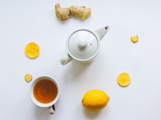 Lemons and ginger on a white background.Healthy food. Ginger Root Tea with Lemon. Healthy ingredients against cold.Top view image of lemon and ginger with copy space. get rid of toxins and boost.