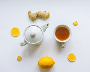Lemons and ginger on a white background.Healthy food. Ginger Root Tea with Lemon. Healthy ingredients against cold.Top view image of lemon and ginger with copy space. get rid of toxins and boost.