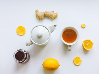 Obraz na płótnie Canvas Lemons and ginger on a white background.Healthy food. Ginger Root Tea with Lemon. Healthy ingredients against cold.Top view image of lemon and ginger with copy space. get rid of toxins and boost.