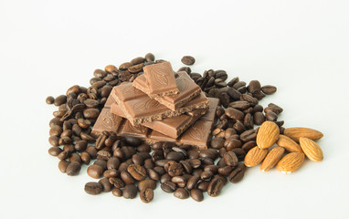 coffee,chocolate,beans,background,spices,anise,cinnamon,sweet,food,brown,nut,dessert,gourmet,almonds,spice,sugar,wooden,tasty,broken,white,cocoa,closeup,delicious,black,orange,isolated,close,snack,mil