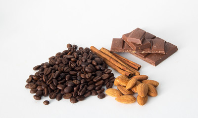 coffee,chocolate,beans,background,spices,anise,cinnamon,sweet,food,brown,nut,dessert,gourmet,almonds,spice,sugar,wooden,tasty,broken,white,cocoa,closeup,delicious,black,orange,isolated,close,snack,mil