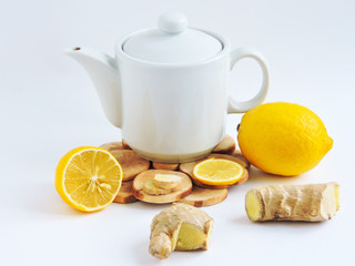Lemons and ginger on a white background.Healthy food. Ginger Root Tea with Lemon. Healthy...