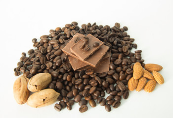 coffee,chocolate,beans,background,spices,anise,cinnamon,sweet,food,brown,nut,dessert,gourmet,almonds,spice,sugar,wooden,tasty,broken,white,cocoa,closeup,delicious,black,orange,isolated,close,snack,mil