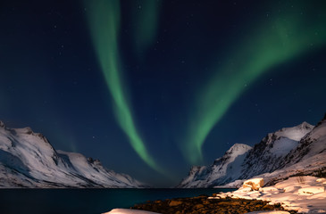 Naklejka na ściany i meble Amazing Aurora Borealis in North Norway (Kvaloya), mountains in the background