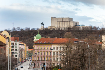 Fototapeta na wymiar Prague panorama with Jan Zizka equestrian statue in front of National memorial Vitkov, Czech Republic, cloudy day