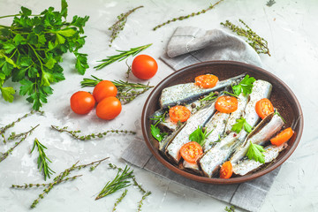 Sardines or baltic herring on ceramic plate