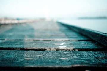 Papier Peint photo autocollant Descente vers la plage old wood sailing pier with depth of fields and endless view