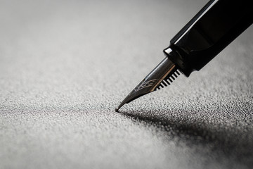 Fototapeta premium Fountain pen with clipping path on black background