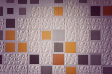 Abstract ceramic wall tiles in the shape of pyramid background.