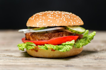 Fresh home made burgers on wooden table