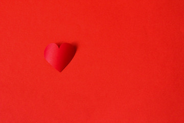 Valentine concept, perfect for card or banner - 3d red heart on the red background, selective focus, free copy space