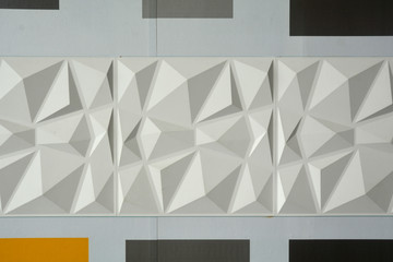 Abstract ceramic wall tiles in the shape of pyramid background.