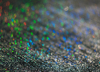 The unfocused background of the silver glitter of water droplets on the black for text, banner, poster, label, sticker, layout.