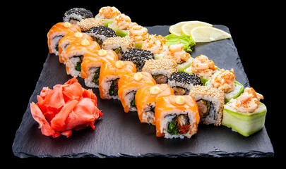 Set of sushi rolls on black background