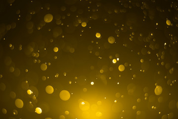 Golden bokeh background on light in the dark night