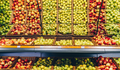 Fresh red and green apple fruits in a supermarket. Different kind of apples