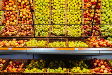 Fresh red and green apple fruits in a supermarket. Different kind of apples