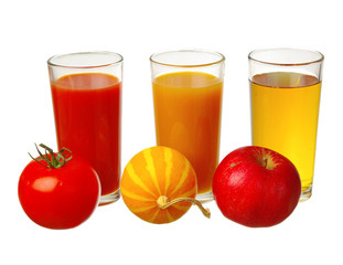 Three glasses with juices and three fruits. Apple juice, pumpkin and tomato