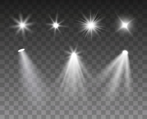 Vector set of spotlight and light burst effects isolated on dark background