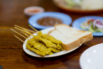 Grilled pork satay with peanut sauce