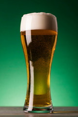 St Patrick's Day beer against a green background