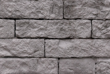 old wet brick wall in grey