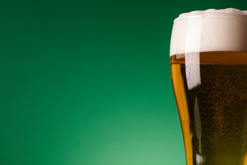 St Patrick's Day beer against a green background