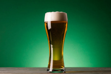 St Patrick's Day beer against a green background