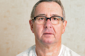 Obraz premium Portrait of a senior man with glasses