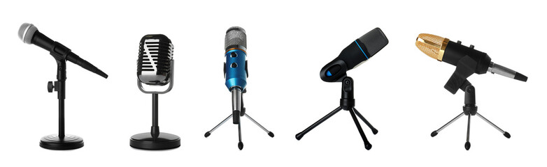 Fototapeta premium Set of different professional microphones in holders on white background