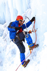 Fototapeta na wymiar ice climber climbing a glacier