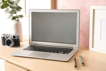 Fototapeta premium Cozy blogger workplace with laptop at home