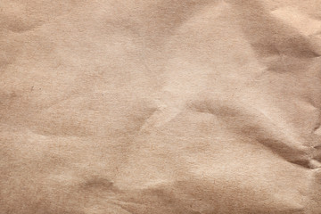 Brown paper bag texture as background, top view