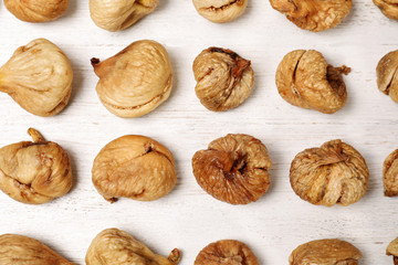 Flat lay composition with sweet figs on  wooden table. Dried fruit as healthy snack