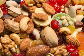 Different dried fruits and nuts as background, closeup