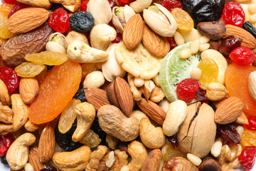 Different dried fruits and nuts as background, closeup