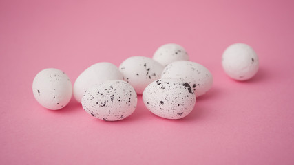 closeup of decorative easter eggs on pink background