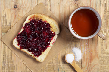 Slices of toast with jam and tea