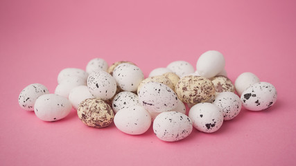 closeup of decorative easter eggs on pink background