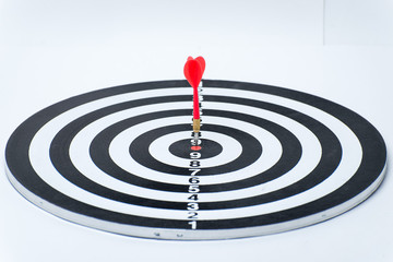 Fototapeta na wymiar Bullseye is a target of business. Dart is an opportunity and Dartboard is the target and goal. So both of that represent a challenge in business marketing as concept.